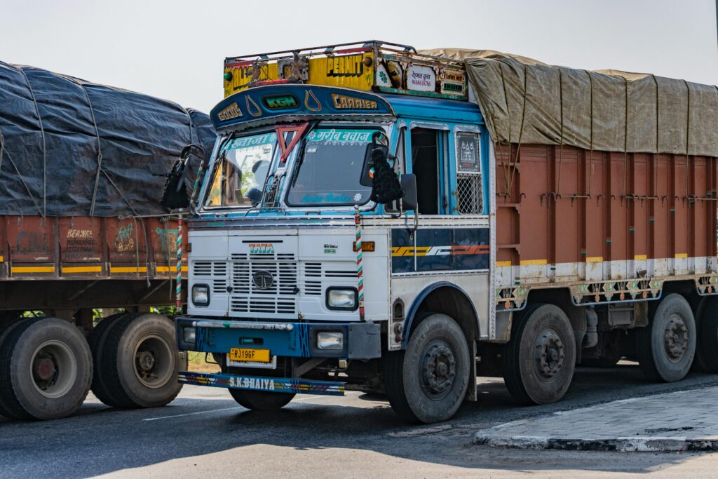 Vibrant Tata truck on an Indian highway near Deeg, Uttar Pradesh showcasing cultural designs.